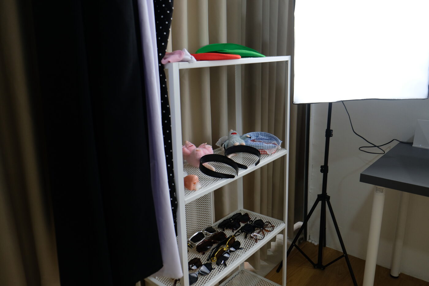 Props shelf with hats, glasses and headbands
